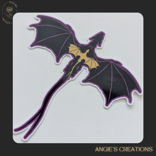 A sticker depicting a purple dragon with yellow accents, resembling a mythical creature.