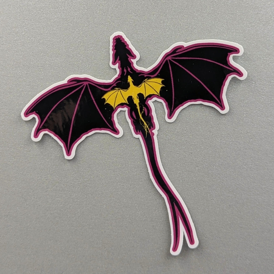 Angie's Creations waterproof die-cut dragon sticker featuring a dramatic black dragon in flight with a pink outline and golden yellow chest detail. Fourth Wing and Empyrean series inspired waterproof sticker designed in Ottawa Canada, perfect for Kindle cases, laptops, water bottles, and journals.