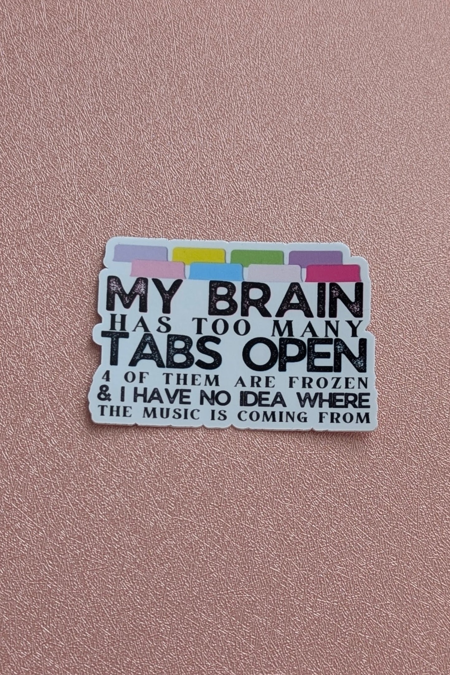 Sticker with text about too many tabs open on a pink background