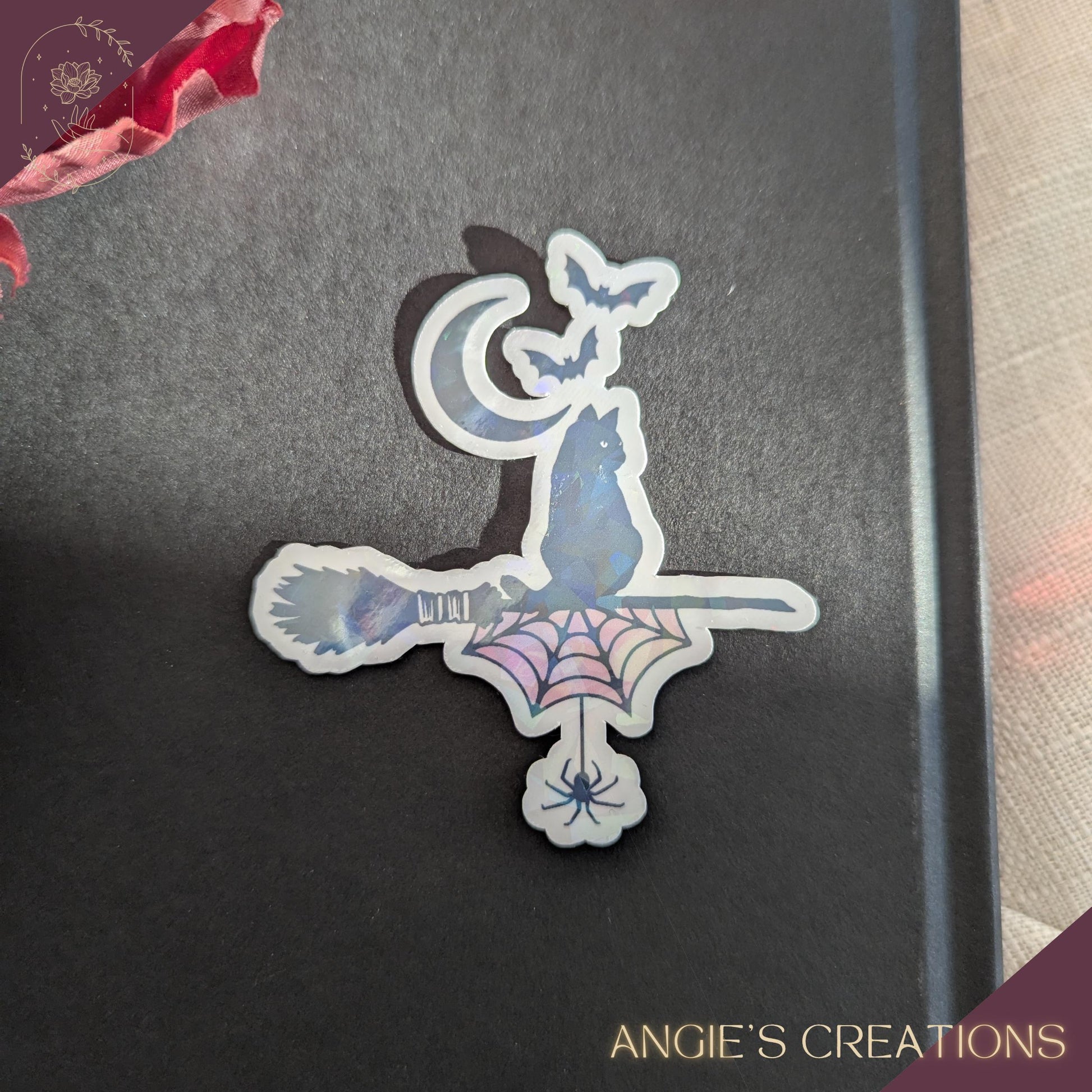 Handmade vinyl sticker with a clean die-cut outline, shown in a bright, clear setting. Designed and produced in Angie’s Creations Ottawa home studio, the sticker features vivid colours, crisp printing, and durable lamination for water and scratch resistance. Ideal for decorating laptops, Kindles, journals, planners, water bottles, notebooks, and gifts. Cozy, bookish, fantasy, and nature-inspired styles depending on the design.