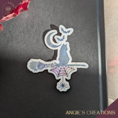 Handmade vinyl sticker with a clean die-cut outline, shown in a bright, clear setting. Designed and produced in Angie’s Creations Ottawa home studio, the sticker features vivid colours, crisp printing, and durable lamination for water and scratch resistance. Ideal for decorating laptops, Kindles, journals, planners, water bottles, notebooks, and gifts. Cozy, bookish, fantasy, and nature-inspired styles depending on the design.
