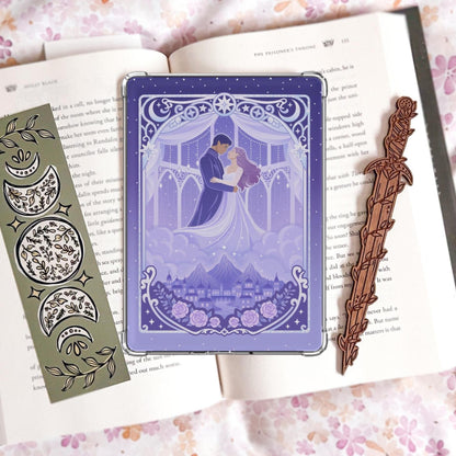 Purple and lavender laminated Kindle insert featuring an illustrated couple embracing under a starry archway with moons and stars above, roses and a moonlit city below.