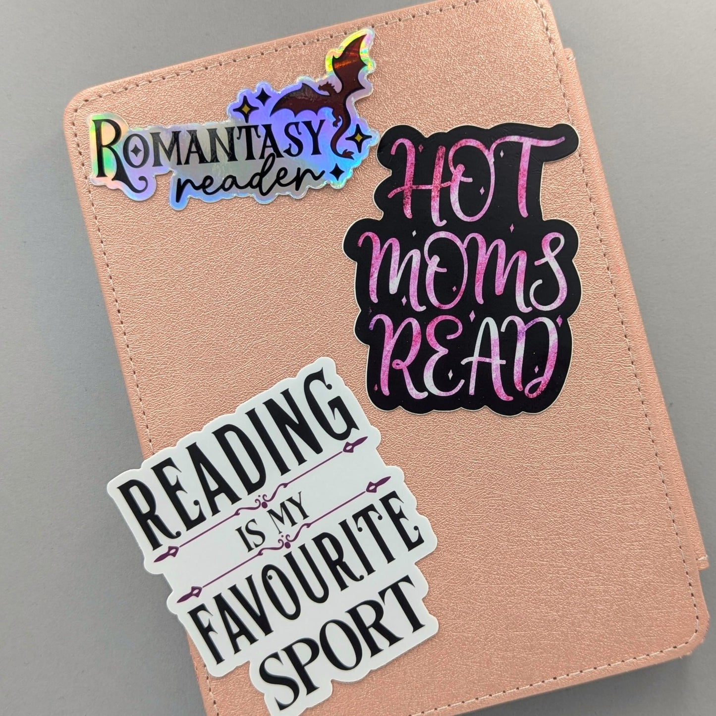 You didn't choose the romantasy life. It chose you. One chapter became one series became a TBR with its own postal code. This holographic sticker is for the girlie with a dragon on her Kindle, a book boyfriend in her heart, and zero apologies about either.