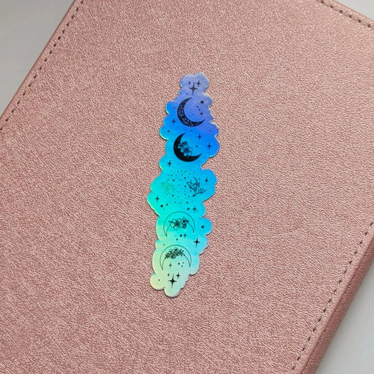 Holographic star and moon design on a pink leather surface